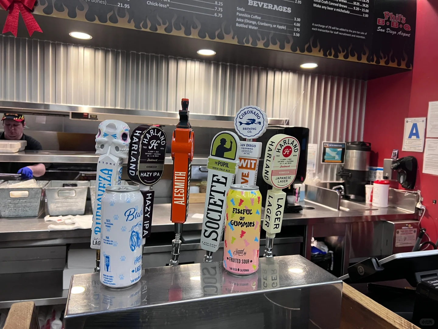 Need a drink before boarding—which one should I order? Waiting online!