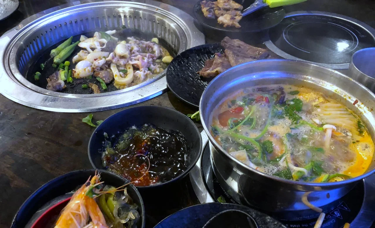 This Spot Next to Denver's Chinatown Lets You Enjoy Hot Pot and Korean BBQ at the Same Time